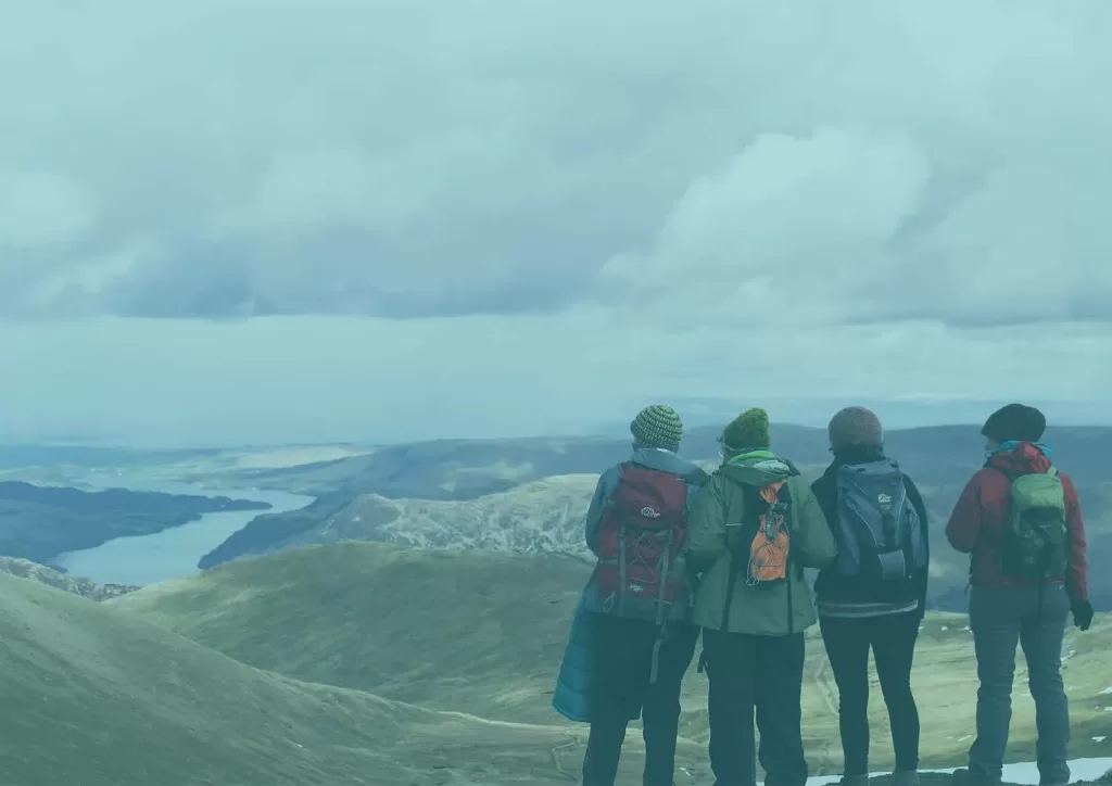 Group of hikers overlooking a hill